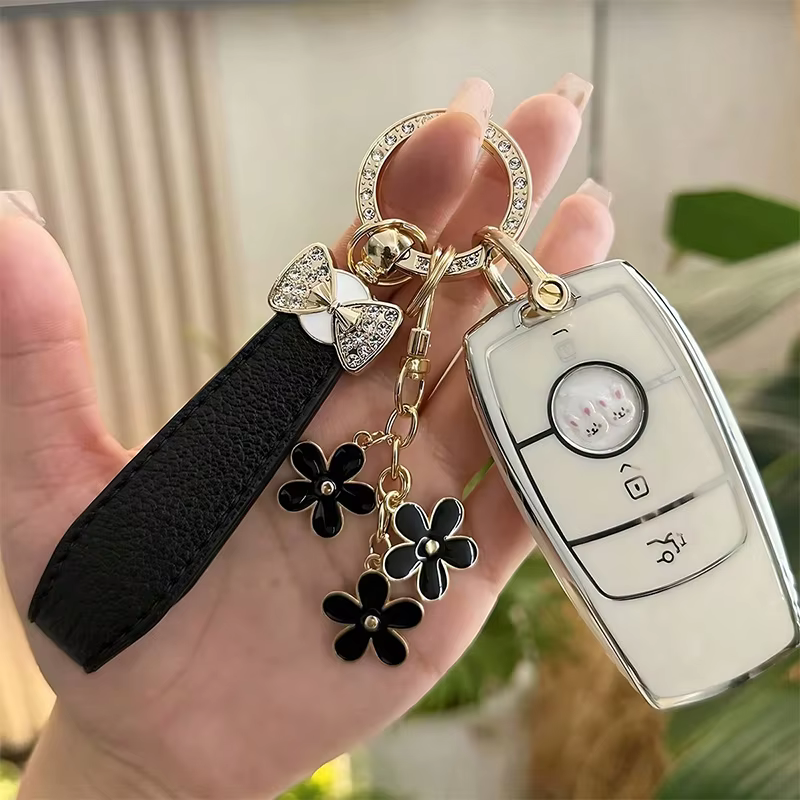 Porte-clés de luxe avec nœud et fleur, accessoire de clé de voiture en cristal élégant, cuir PU Durable, cadeau à la mode pour femmes, apparence exquise