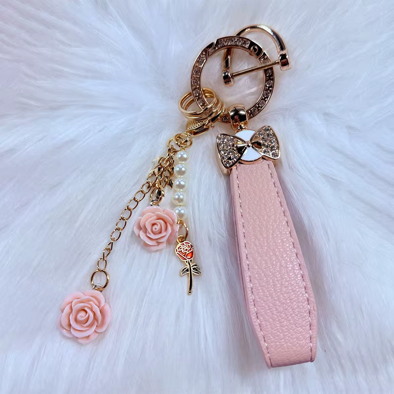 Porte-clés de luxe avec nœud et fleur, accessoire de clé de voiture en cristal élégant, cuir PU Durable, cadeau à la mode pour femmes, apparence exquise