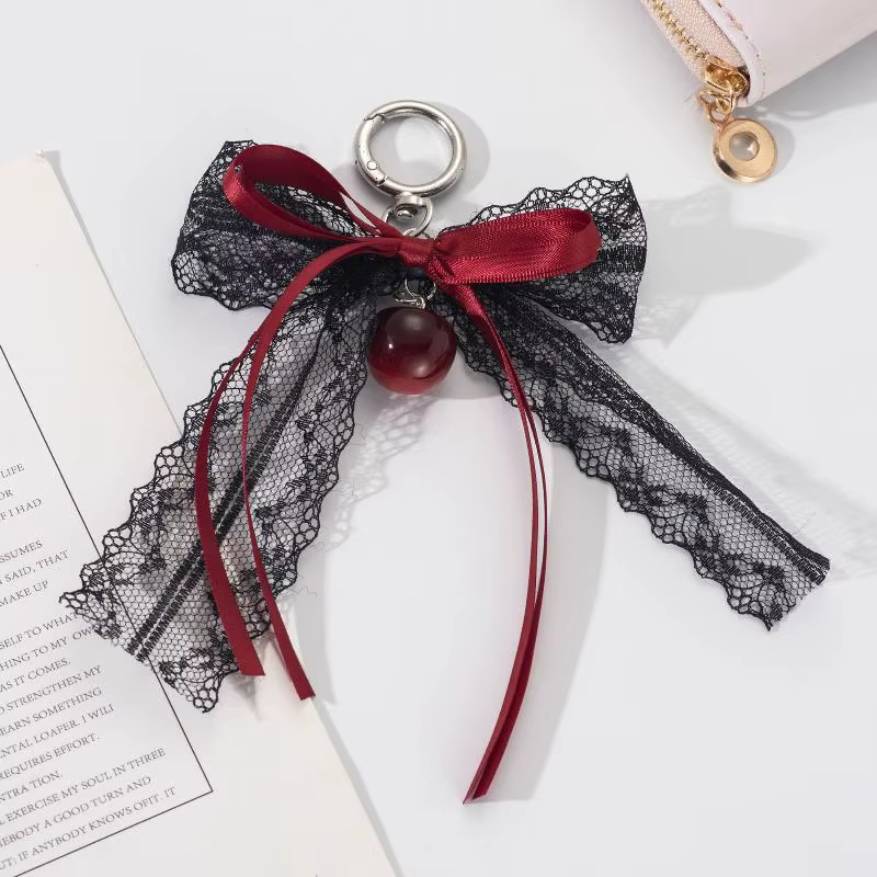 Porte-clés cadeau mignon pour la Saint-Valentin, nœud en dentelle avec chaîne de perles et breloque étoile. Accessoire de sac en ruban de ballet pour femme