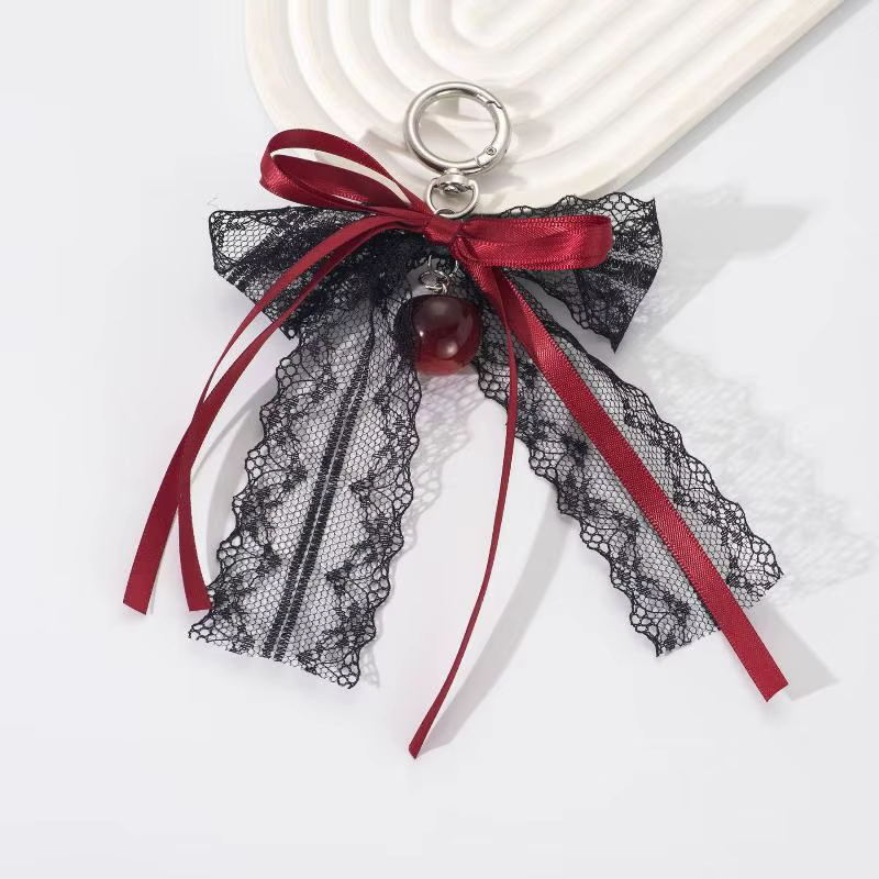 Porte-clés cadeau mignon pour la Saint-Valentin, nœud en dentelle avec chaîne de perles et breloque étoile. Accessoire de sac en ruban de ballet pour femme